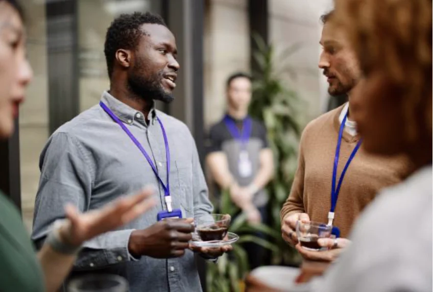 man talking to group of people