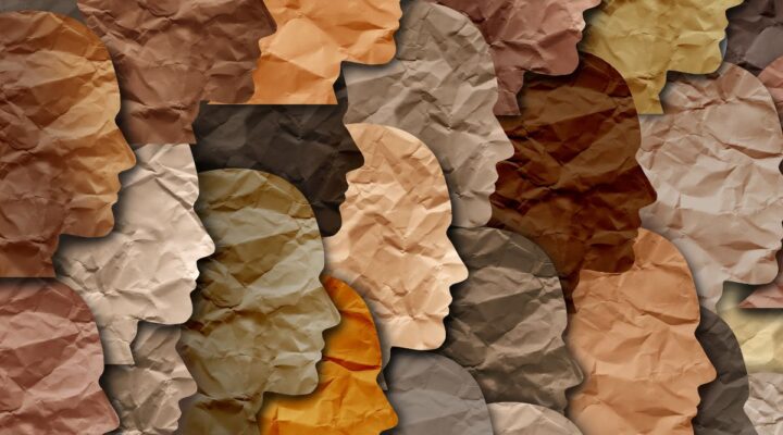 Paper profiles of faces in different colours for Black History Month