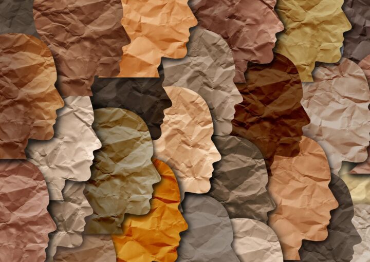 Paper profiles of faces in different colours for Black History Month