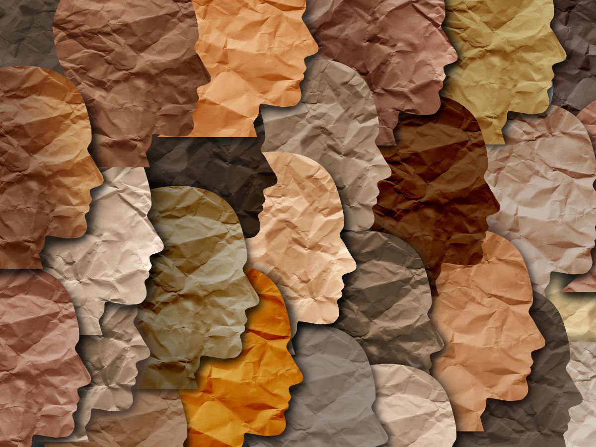 Paper profiles of faces in different colours for Black History Month