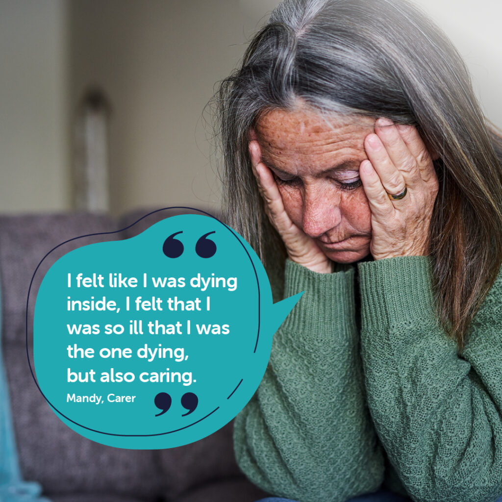 Woman with depression sitting with head in hand