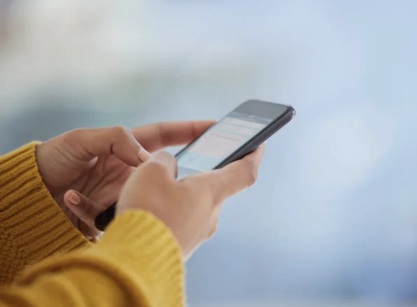 person using a carers discount card on phone