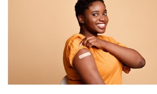 lady smiling with plaster on arm