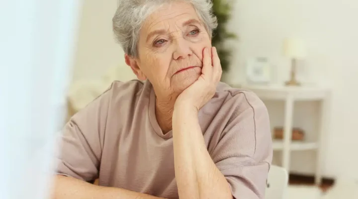 Woman looking into distance - sad