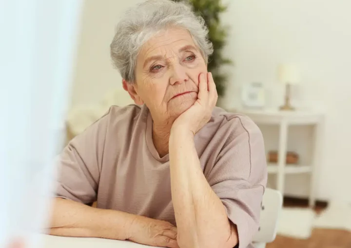 Woman looking into distance - sad