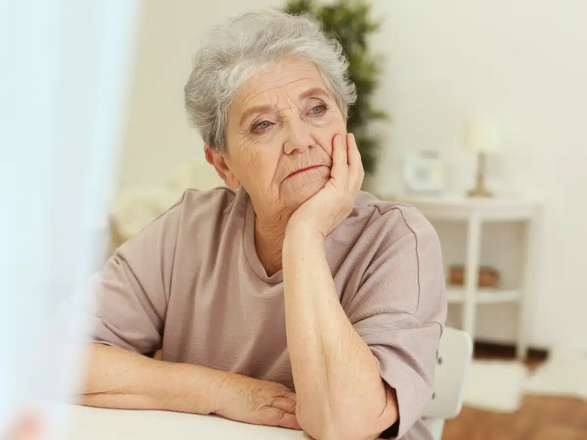 Woman looking into distance - sad