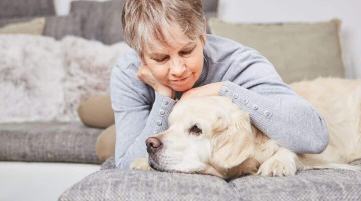 Woman pets a dog