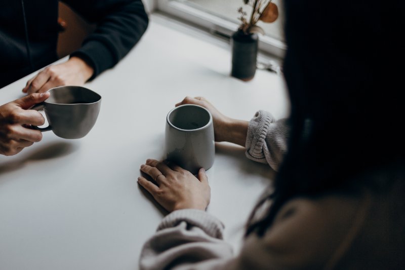 individual holding a mug