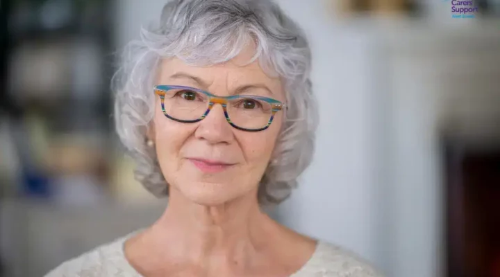 older woman looking at camera smiling