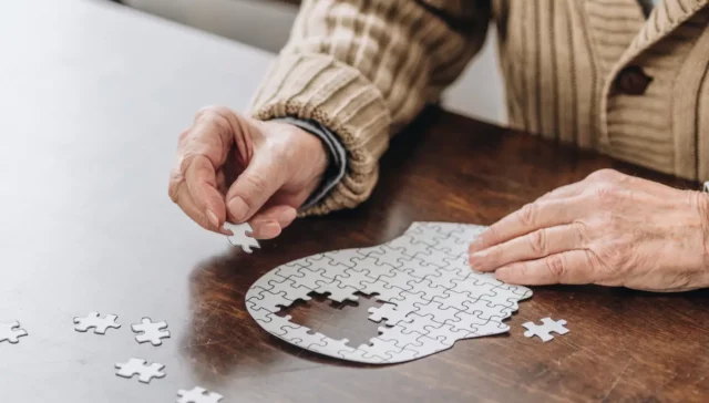 puzzle of head with pieces missing
